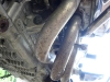 Grounded exhaust headers and engine bar